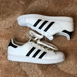 White Adidas Superstar.